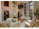 Stylish living room featuring exposed brick, high ceilings, and chic, modern decor at 170 Boulevard Se # 115E, Atlanta, GA 30312
