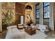 Bright living room featuring exposed brick, tall windows, and modern furnishings at 170 Boulevard Se # 115E, Atlanta, GA 30312