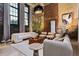 Bright living room showcasing a modern design with exposed brick and large windows at 170 Boulevard Se # 115E, Atlanta, GA 30312