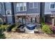 Backyard patio featuring a hot tub, stone details, and a cozy seating area at 3005 Devoncroft Se St, Smyrna, GA 30080