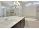 Elegant bathroom with double vanity, soaking tub, and a glass-enclosed shower at 3005 Devoncroft Se St, Smyrna, GA 30080