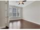 Bright and airy bedroom with three windows allowing ample natural light, and wood floors at 3005 Devoncroft Se St, Smyrna, GA 30080