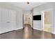Bright bedroom with hardwood floors, closet, flat screen tv and access to the bathroom at 3005 Devoncroft Se St, Smyrna, GA 30080