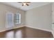 Bright, minimalist bedroom with hardwood floors and a private balcony at 3005 Devoncroft Se St, Smyrna, GA 30080