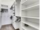 Spacious walk-in closet with custom shelving and ample storage space for organization at 3005 Devoncroft Se St, Smyrna, GA 30080