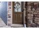 Inviting front door with a stone facade, wreath, and stylish accents at 3005 Devoncroft Se St, Smyrna, GA 30080