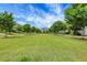 Expansive grassy common area lined with trees and walking paths and benches offering relaxing community space at 3005 Devoncroft Se St, Smyrna, GA 30080