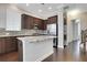 Open kitchen featuring stainless steel appliances and dark wood cabinets and hardwood floors at 3005 Devoncroft Se St, Smyrna, GA 30080