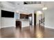 Spacious living room and kitchen with hardwood floors, stainless steel appliances, and abundant natural light at 3005 Devoncroft Se St, Smyrna, GA 30080
