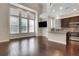 Modern kitchen and living space with tall ceilings and large windows at 3005 Devoncroft Se St, Smyrna, GA 30080
