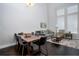 Open-concept living room and dining area filled with natural light at 3005 Devoncroft Se St, Smyrna, GA 30080