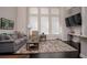 Comfortable living room area with tall windows and modern decor at 3005 Devoncroft Se St, Smyrna, GA 30080