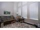 Bright living room with tall windows, neutral paint, and comfortable seating arrangements at 3005 Devoncroft Se St, Smyrna, GA 30080