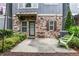 Exterior patio featuring an outdoor seating area, landscaping, and privacy greenery at 3005 Devoncroft Se St, Smyrna, GA 30080