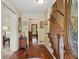 Inviting foyer with hardwood floors, staircase, and a view into adjoining rooms with natural light at 878 Park Creek Sw Ct, Marietta, GA 30064