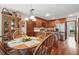 Open kitchen and dining area featuring wood cabinets and stainless steel appliances at 878 Park Creek Sw Ct, Marietta, GA 30064
