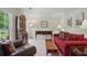 Cozy living room with comfortable seating, natural light, and classic furnishings on neutral carpet at 878 Park Creek Sw Ct, Marietta, GA 30064