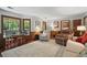 Bright living room featuring comfortable seating, large windows, and classic decor with natural lighting at 878 Park Creek Sw Ct, Marietta, GA 30064