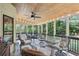 Relaxing screened-in porch complete with a ceiling fan, an outdoor seating area, and views of the surrounding greenery at 878 Park Creek Sw Ct, Marietta, GA 30064