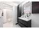Modern bathroom with sleek vanity, mirror, and bath, designed for comfort and style at 881 Memorial Se Dr # 307, Atlanta, GA 30316