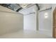 Bright and airy bedroom with industrial design elements and modern lighting fixture at 881 Memorial Se Dr # 307, Atlanta, GA 30316