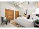 Inviting bedroom featuring ample closet space, plush bedding, and chic decor for a cozy living experience at 881 Memorial Se Dr # 307, Atlanta, GA 30316