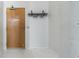 Clean entrance showcasing a sturdy door, shelving, and hook rack for convenience at 881 Memorial Se Dr # 307, Atlanta, GA 30316