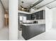 Modern kitchen features stainless steel appliances, dark cabinets, and an open layout at 881 Memorial Se Dr # 307, Atlanta, GA 30316