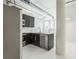 Open kitchen features black cabinets, stainless steel appliances, and industrial-style elements at 881 Memorial Se Dr # 307, Atlanta, GA 30316