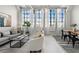 Bright, spacious living room with large windows, modern decor, and hardwood floors, perfect for relaxing or entertaining at 881 Memorial Se Dr # 307, Atlanta, GA 30316