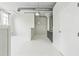 Open-concept space with kitchen area, featuring industrial-style ceilings and bright white walls at 881 Memorial Se Dr # 307, Atlanta, GA 30316