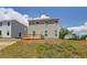 Back of the house with a wooden deck in backyard on a sunny day at 17 Camellia Dr, Fairburn, GA 30213
