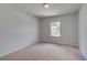 Neutral bedroom with a window bringing in natural light and plush carpet at 17 Camellia Dr, Fairburn, GA 30213