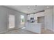 Modern kitchen with white cabinets, a center island, stainless steel appliances, and plank flooring at 17 Camellia Dr, Fairburn, GA 30213