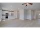 Open-concept living area featuring modern flooring, stainless steel appliances, white cabinets, and kitchen island at 17 Camellia Dr, Fairburn, GA 30213