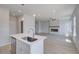 Open concept living room showcases a fireplace, ceiling fan, large windows, and hardwood floors at 17 Camellia Dr, Fairburn, GA 30213