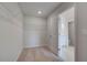 Spacious walk-in closet with shelving and neutral carpet, leading to the Primary bathroom at 17 Camellia Dr, Fairburn, GA 30213