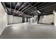 Spacious basement with painted floors and exposed ceiling beams at 2035 Stilesboro Nw Dr, Kennesaw, GA 30152