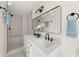 Modern bathroom with a double sink vanity, updated fixtures, and a tiled shower at 2035 Stilesboro Nw Dr, Kennesaw, GA 30152