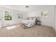 Bright bedroom featuring neutral walls, carpet, and a plush bed with decorative pillows at 2035 Stilesboro Nw Dr, Kennesaw, GA 30152