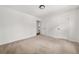 Empty bedroom featuring neutral walls, carpet, and a door leading to another room at 2035 Stilesboro Nw Dr, Kennesaw, GA 30152