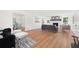 Bright living room with hardwood floors, a fireplace, and contemporary furnishings at 2035 Stilesboro Nw Dr, Kennesaw, GA 30152