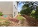 Fenced backyard with mature trees and landscaping at 4060 Brumby Ln, Cumming, GA 30041