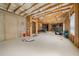 Unfinished basement with exposed framing and high ceilings ready to be finished at 4060 Brumby Ln, Cumming, GA 30041
