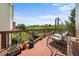 Relaxing wooden deck with a swing and plenty of potted plants at 4060 Brumby Ln, Cumming, GA 30041