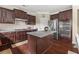 Well-equipped kitchen featuring stainless steel appliances, granite countertops, and a center island at 4060 Brumby Ln, Cumming, GA 30041