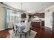 Bright kitchen with a dining area, stainless steel appliances, and ample cabinet space at 4060 Brumby Ln, Cumming, GA 30041