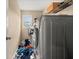 Laundry room with a large capacity washer and storage shelving above at 4060 Brumby Ln, Cumming, GA 30041