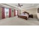 Large main bedroom with a tray ceiling, ample natural light, and neutral decor at 4060 Brumby Ln, Cumming, GA 30041