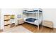 bedroom with a bunk bed, hardwood floors, rug, and a bookshelf at 511 Pine Springs Se Trl, Marietta, GA 30067
